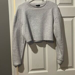 Cropped grey crewneck sweatshirt